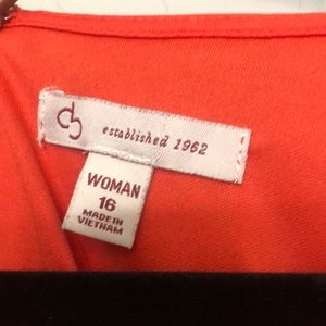 Orange dress looks red in pics but more of an orange tone in person